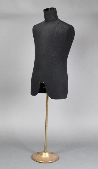A fibre tailor's mannequin raised on a brass reeded stand 52" 
