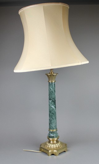 A granite finished and gilt mounted table lamp raised on a gilt metal and acanthus base 19" 