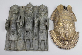 A bronze Benin style plaque depicting 3 standing warriors 11" x 9 1/2" and an oval bronze mask of mythical beast 11" 