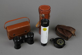 A prismatic compass the reverse marked patent number 1818/15 with leather carrying case, pair of HOC 2.5X opera glasses, and an Orbit 25 x 30 mm minocular 