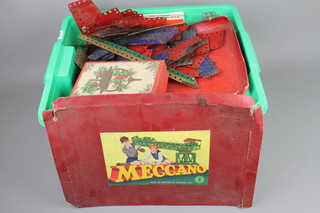 A collection of red and green Meccano 