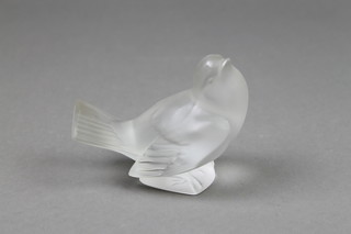 A modern Lalique opalescent figure of a dove, the base marked Lalique France 4"