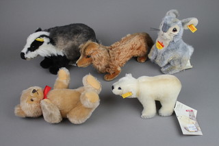 A Steiff classic figure of a badger 5", a Steiff figure of a Dachshund - Waldi 5", a Steiff figure of a rabbit 7", a Steiff light brown bear with articulated limbs 7", a Steiff figure of a polar bear - Siro 4"