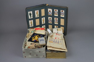 An album of various cigarette cards, a quantity of various loose cigarette cards and a collection of cigarette packets contained in 2 shallow boxes