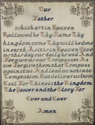 A Victorian wool work sampler of The Lords Prayer, contained in a maple frame 17" x 13" 