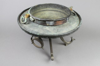 A circular Chinese engraved copper charcoal burner raised on 3 scallop supports 9"