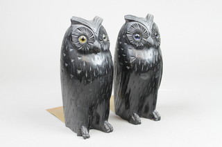 A pair of carved wooden book ends in the form of owls 8" 