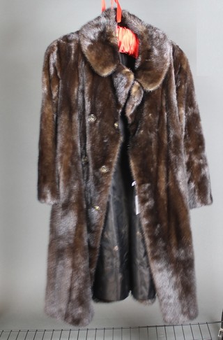 A black full length fur coat 