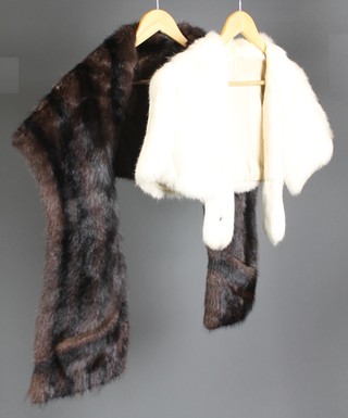 A brown fur jacket together with a white fur stole