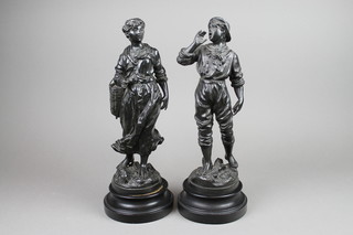 A pair of spelter figures of boy and girl 14"