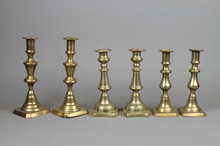 4 pairs of 19th Century brass candlesticks with ejectors 7 1/2" and 8 1/2" 