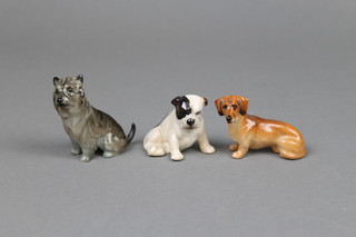3 Royal Doulton figures of dogs - a seated Dachshund K17 2 1/2", a seated bull dog K23 2" and a seated terrier K11 2 1/2" 