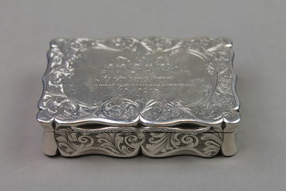 A Victorian silver rectangular table snuff box with chased formal floral decorations and presentation inscription, Birmingham 1846, maker Edward Smith, approx. 142 grams, 3 1/4" x 2" 