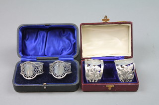 2 pairs of cased silver napkin rings, Sheffield 1914 and Sheffield 1909, approx 122 grams