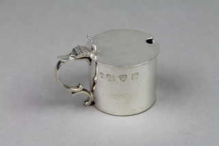 A silver Georgian design mustard with S scroll handle Chester 1939, approx 96 grams, no liner 