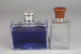 An Edwardian silver and tortoiseshell mounted toilet bottle with floral cut decoration 5", a ditto bottle with plated cover