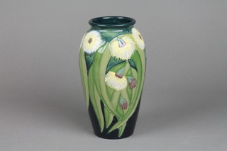 A late 20th Century Moorcroft oviform vase, green ground with stylised flowers, printed marks 7.5"(This lot is cracked)