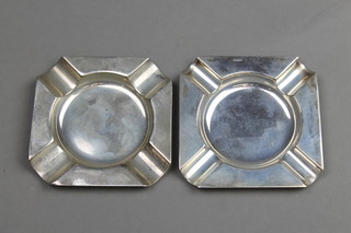 A near pair of silver ashtrays, approx. 68 grams