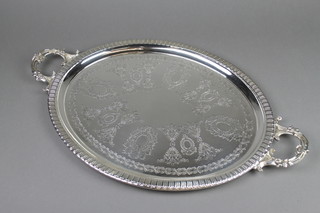 An oval silver plated 2 handled tray with chased floral decoration 23"