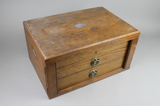 An Edwardian oak 2 drawer canteen with inset brass handles 