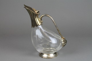 A glass decanter with silver plated mounts and fluted spout 10"