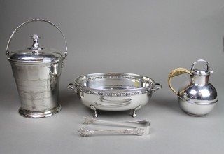 A silver plated ice bucket and lid, a jersey jug, bowl and ice nips