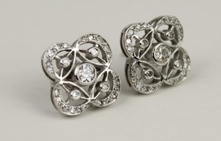A pair of 18ct white gold Edwardian style open diamond ear studs