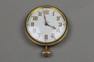 A gilt 8 day travelling timepiece, 2 3/4" 