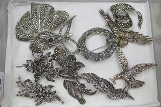 A collection of silver and other marcasite brooches