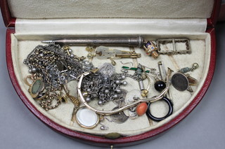 A Moroccan leather jewel case containing a quantity of Victorian and other costume jewellery 