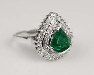 An 18ct white gold pear shaped emerald and diamond cluster ring, the centre stone approx 3 cts, surrounded by 2 tiers of brilliant cut diamonds, size Q 1/2