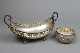 A Continental silver pierced boat shaped bowl with S scroll handles and open scroll feet, approx. 260 grams 10", a ditto Indian repousse bowl approx. 62 grams