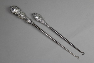 2 silver handled button hooks 2 1/2" and 9 1/2" 