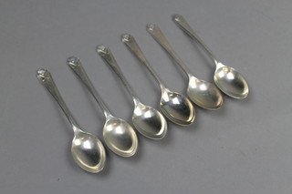 A set of 6 matched silver golf teaspoons, approx 84 grams 