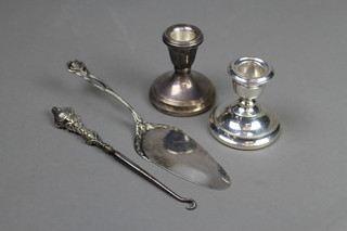 2 silver dwarf candlesticks, a button hook and slice 