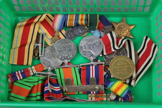 Family medals. World War One trio to Second Lieutenant. later Lieutenant. H.V.Hughes.RE together with miniatures World War One trio and T.E.M., Special Constabulary to George H Hughes and 6 World War Two medals together with a badge 