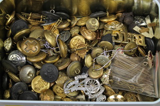 A quantity of Second World War and other brass badges and buttons