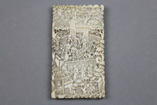 A 19th Century carved Cantonese ivory card case profusely decorated with figures in pavilion gardens 3 1/2" x 2"  