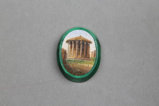 A 19th Century Italian micro mosaic plaque, the malachite body decorated with a classical pavilion 1" x 3/4" 