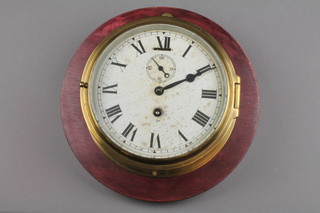 A ward room style clock with 5 1/2" painted dial, Roman numerals, subsidiary second hand, contained in a brass case 