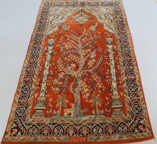 A Persian orange ground rug with mihrab and 2 pillars decorated birds, with signature 83" x 49" 
