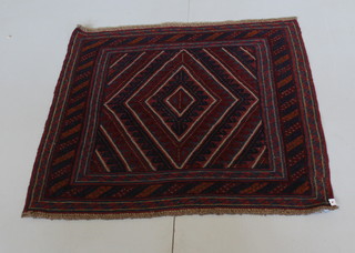 A blue and red ground tribal Gazak rug with stylised diamond to the centre 45" x 44" 