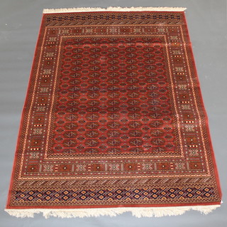 A rose ground Bokhara style Belgian cotton carpet 59 1/2" x 63