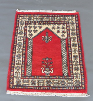 A white and red ground Uzbek prayer rug 9 1/2" x 33 1/2"