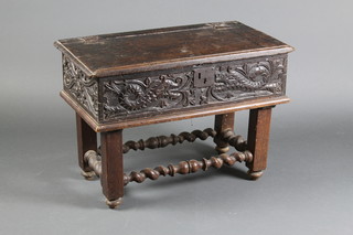 A 17th/18th Century carved oak bible box with iron lock plate, hinged lid, raised on an associated later base 20"h x 28"w x 15"d