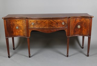 An Edwardian Georgian style sideboard of serpentine outline fitted 1 long drawer, flanked by a pair of cupboards, raised on square tapering legs with splayed feet 35"h x 23 1/2"w x 20"d