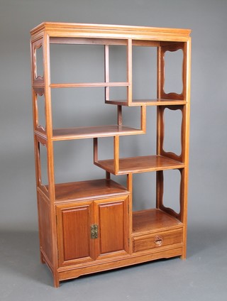 A Chinese rosewood cabinet fitted numerous shelves, the base fitted a drawer and a cupboard 66"h x 40"w x 16"d 