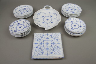 A Royal Copenhagen onion pattern service comprising a leaf shaped plate, 12 saucers and 10 side plates together with a similar kettle stand