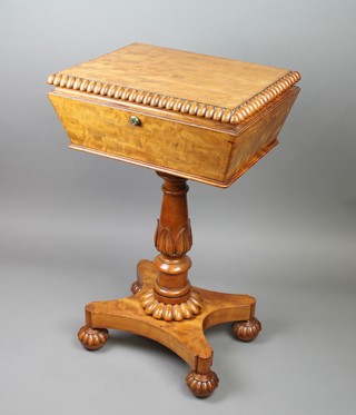 A Regency satinwood rectangular Teapoy with gadrooned decoration, the hinged lid revealing 2 tea caddies, mixing bowl and replacement mixing/sugar bowl, raised on a turned column with triform base and bun feet, 28"h x 17"w x 13 1/2"d 