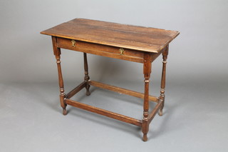 An 18th Century rectangular oak side table fitted 1 long drawer, raised on turned supports 29"h x 35"w x 18"d